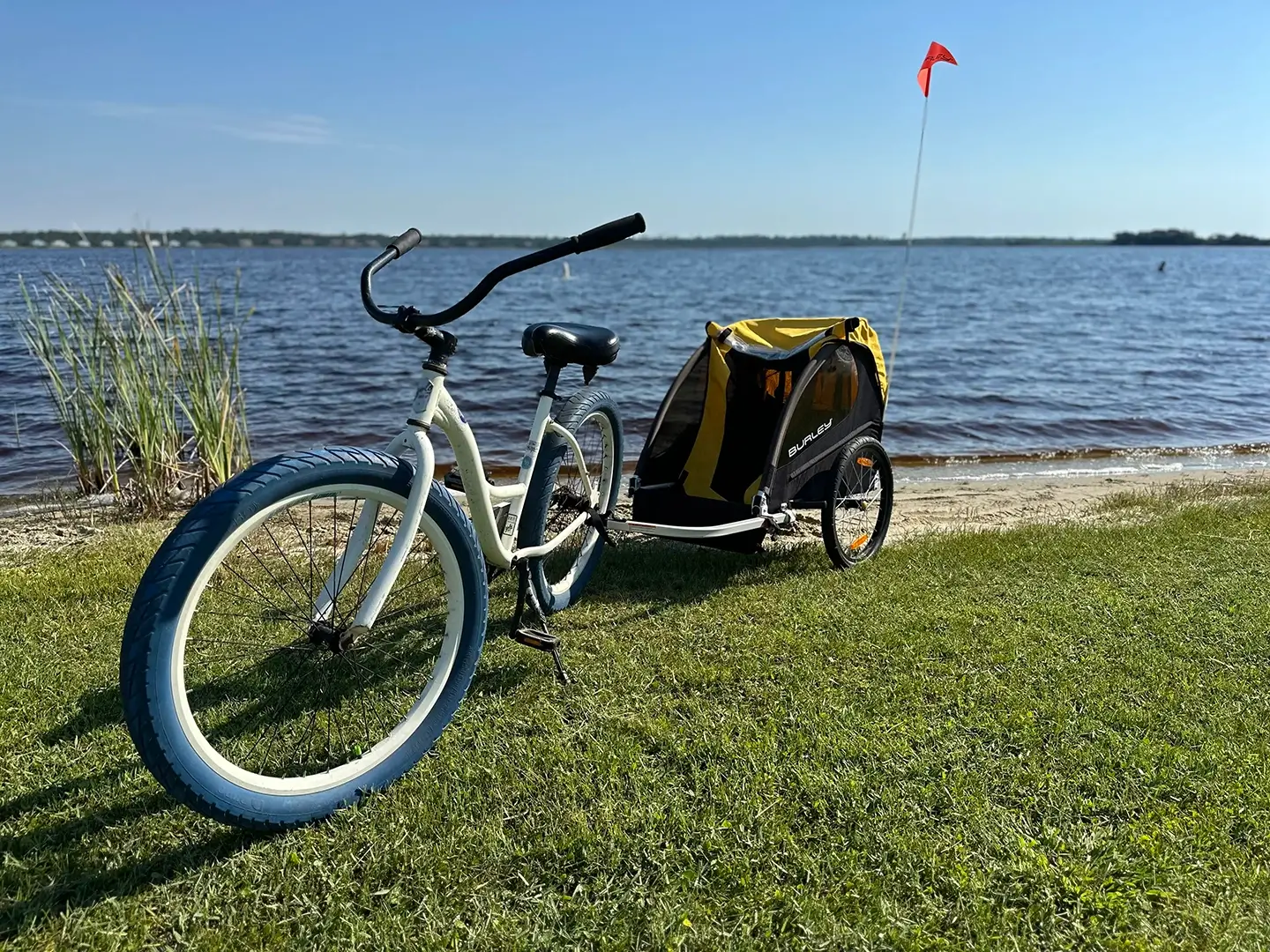 eBike with child trailer by water